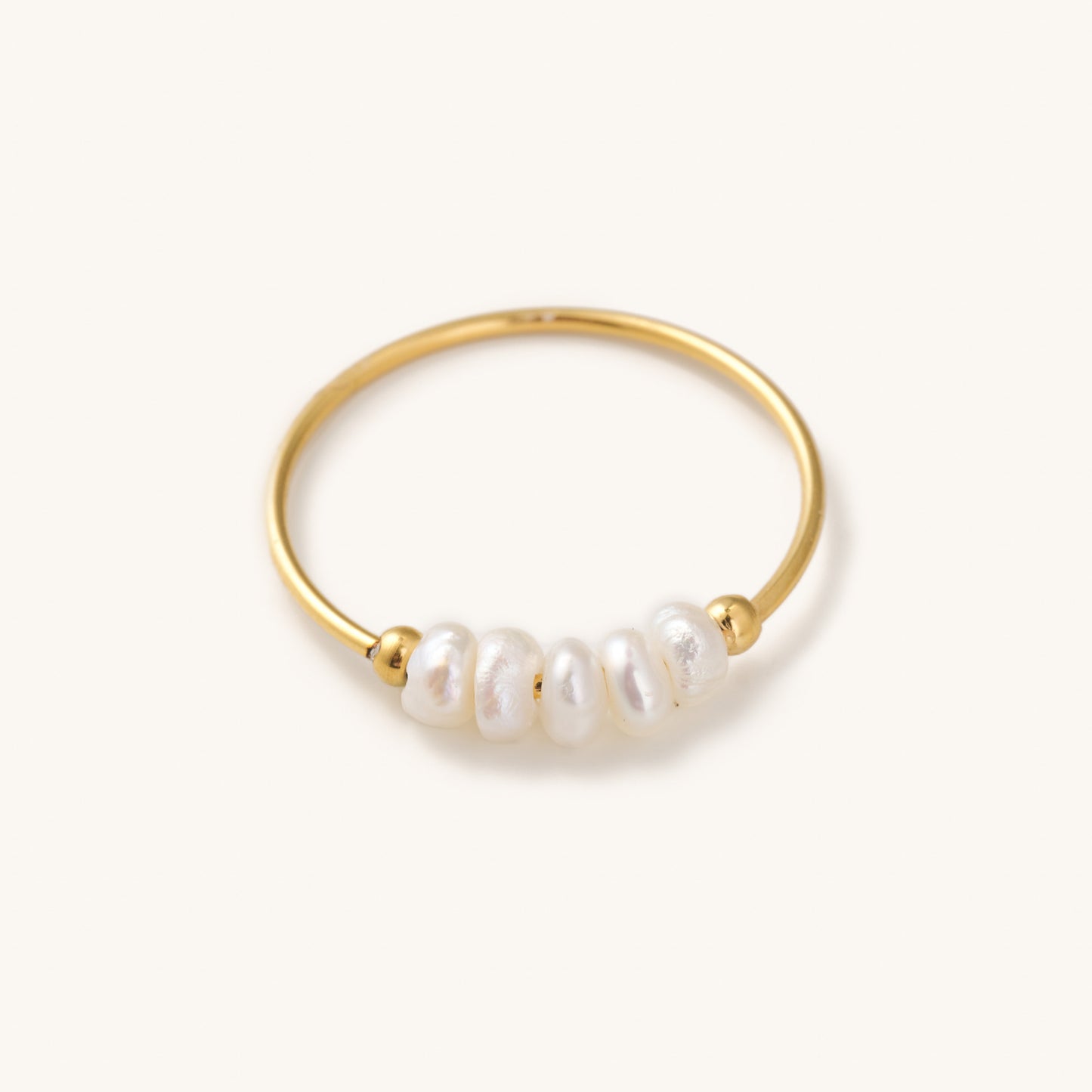dainty gold ring with a string of small real pearls