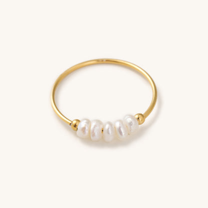 dainty gold ring with a string of small real pearls
