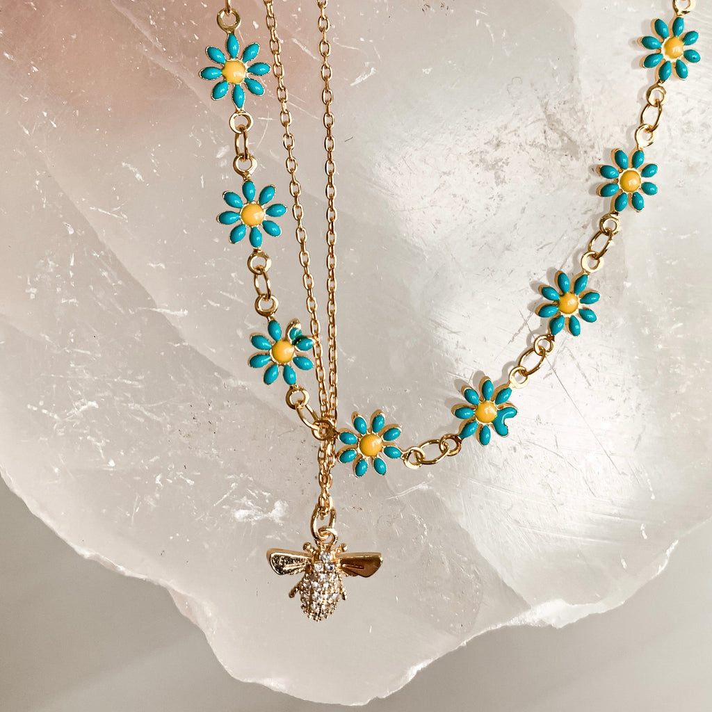 gold bee charm necklace and daisy choker 