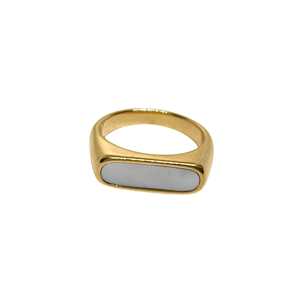 gold ring with white oval shell piece in the middle